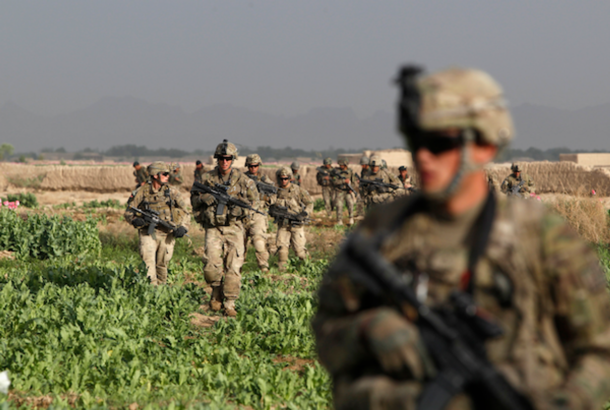 U.S. Army soldiers from 4-73 Cavalry Regiment, 82nd Airborne Division walk during a mission in Zhary district of Kandahar province, southern Afghanistan April 17, 2012 (REUTERS/Baz Ratner)