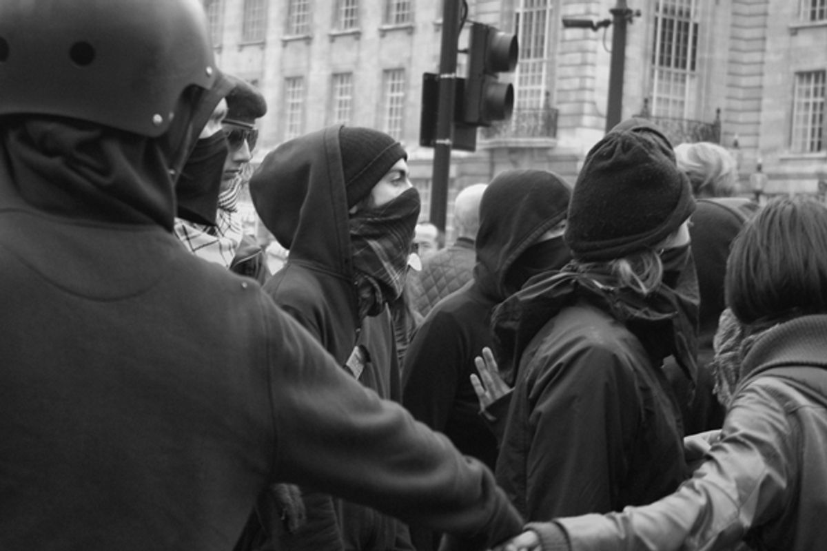 A Black bloc protest in London.     (<span about='http://www.flickr.com/photos/alightbourne/5613721669/' xmlns:cc='http://creativecommons.org/ns#'><a href='http://www.flickr.com/photos/alightbourne/with/5613721669/' rel='cc:attributionURL' target='_blank'>alightman</a> / <a href='http://creativecommons.org/licenses/by/3.0/' rel='license' target='_blank'>CC BY 3.0</a></span>)