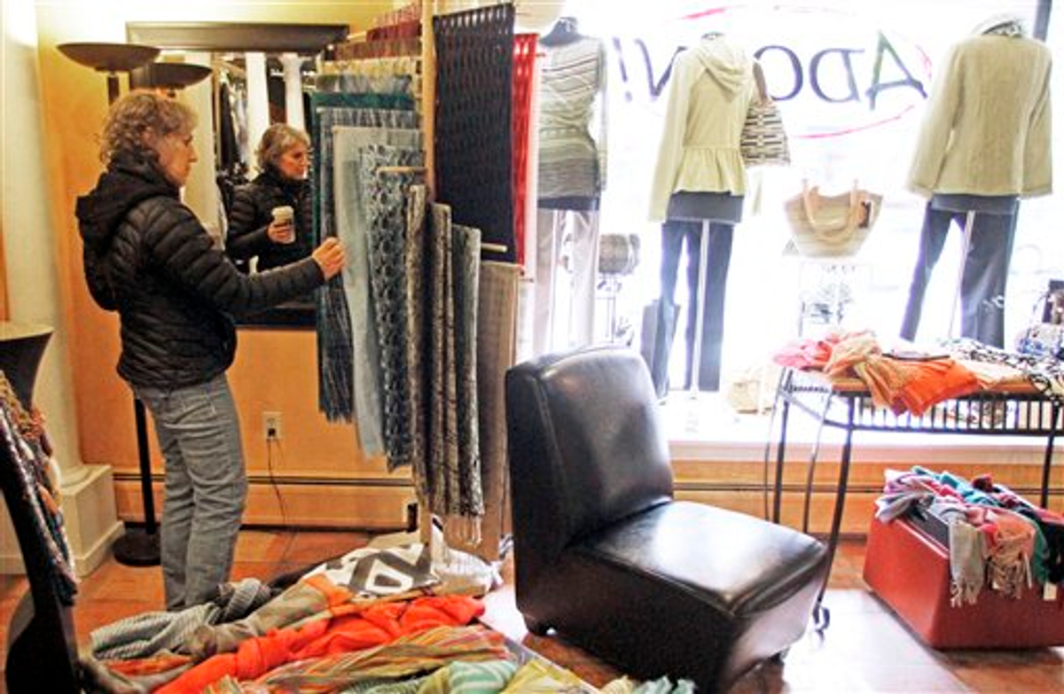 In this Feb. 28, 2012, Laurie Hanson looks over clothing at the Adorn clothing store in Montpelier, Vt.   (AP Photo/Toby Talbot)