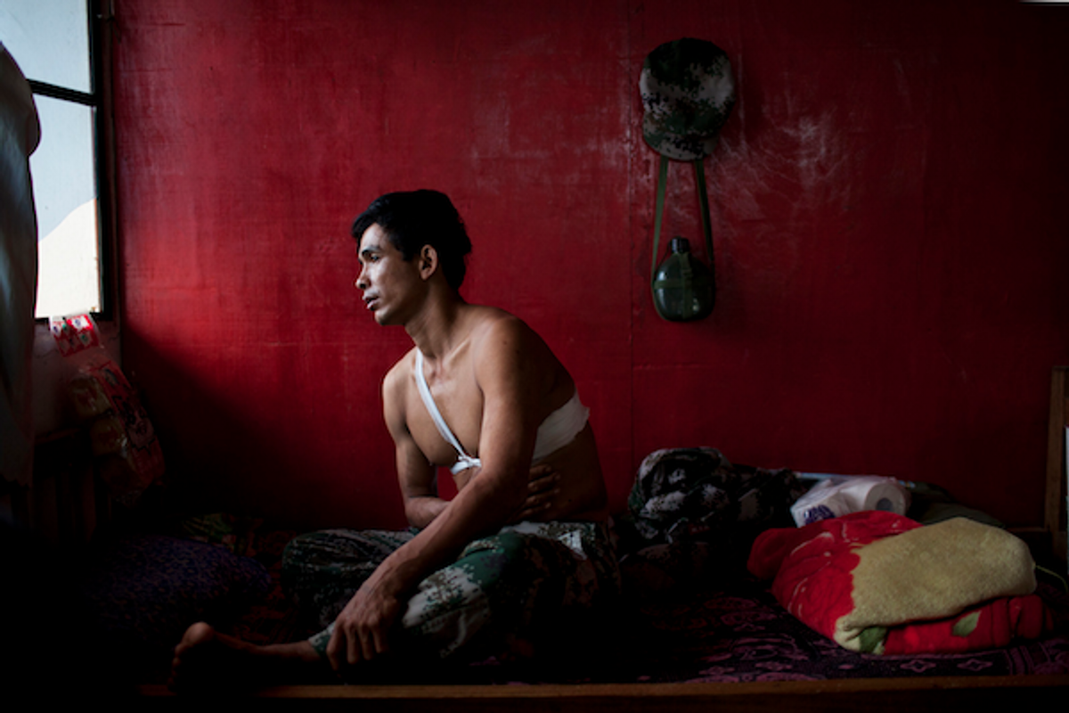  Saw Htet Aung, a 42-year-old soldier in the Kachin Independence Army, recovers at Laiza Military Hospital, near Laiza, Burma, March 30, 2012. Saw Htet Aung was shot in the torso while on patrol in Ban Dawng, on March 21, 2012.    (Will Baxter/GlobalPost)