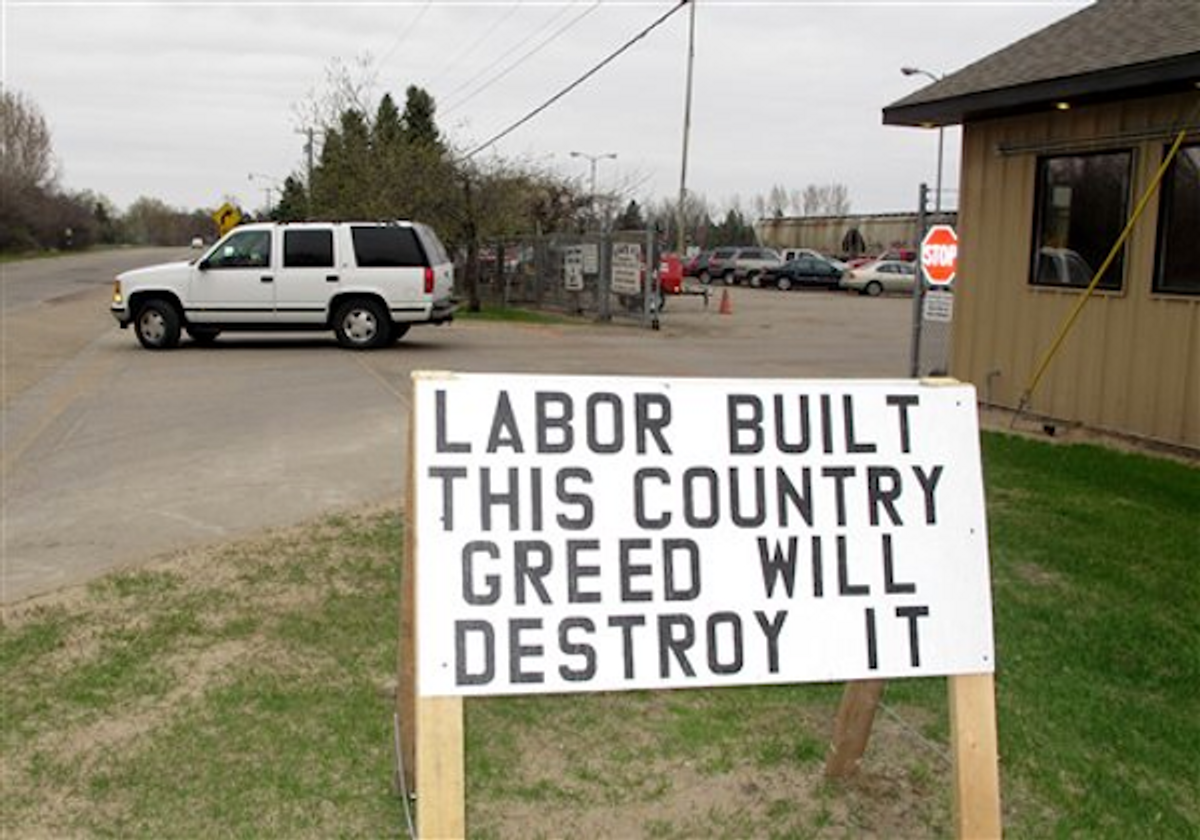  A pro-labor sign is posted outside the entrance of the American Crystal Sugar Co. plant in Moorhead, Minn., Monday, April 2, 2012        (AP Photo/Dave Kolpack)