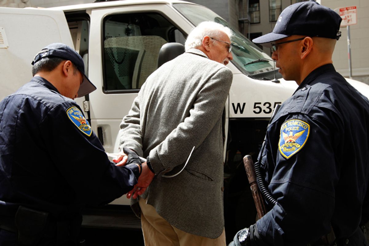 San Francisco police arrest a demonstrator during a protest outside of a Wells Fargo shareholders meeting on Tuesday.     (Reuters/Robert Galbraith)