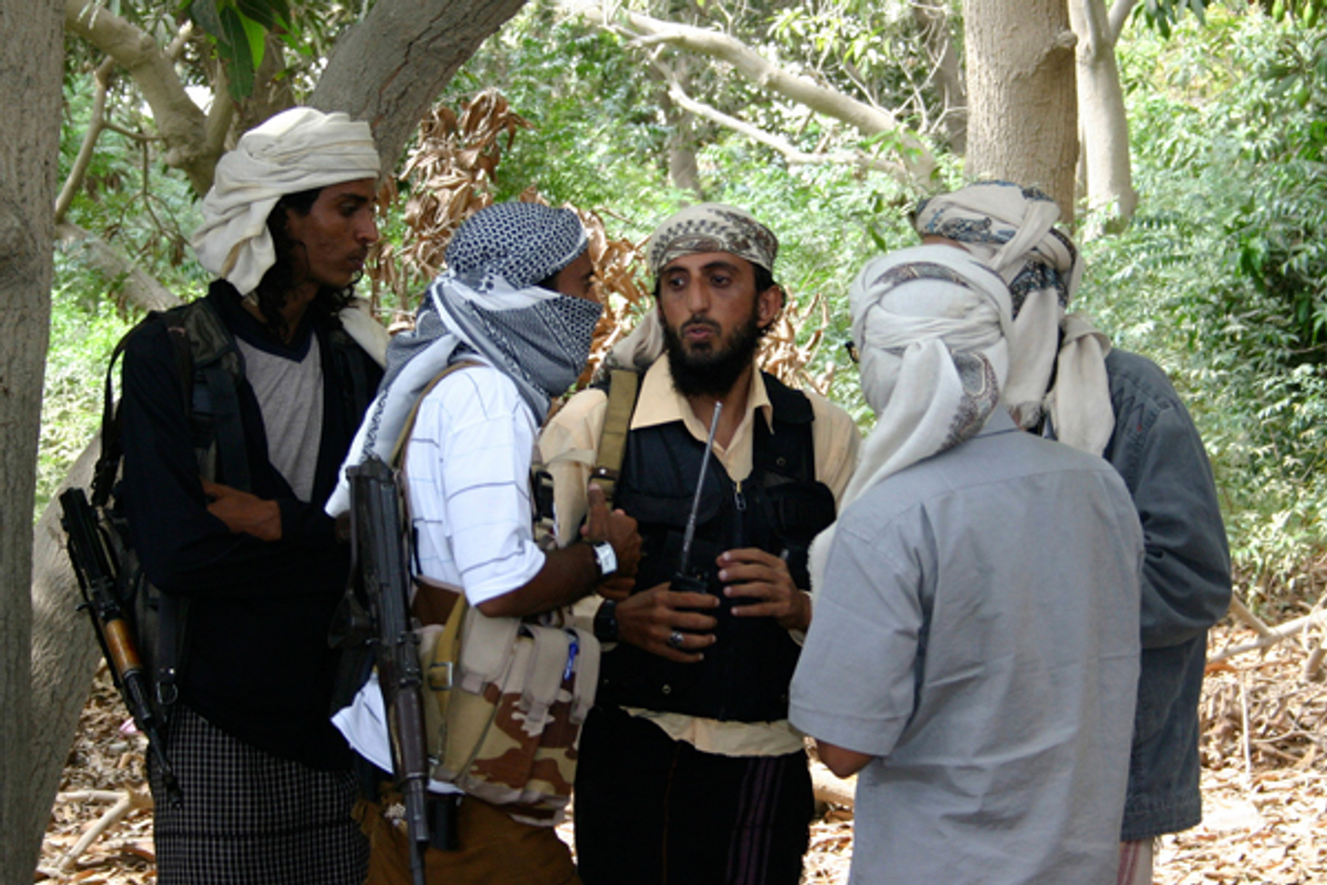 Members of a group affiliated with Al-Qaida talk in the southern Yemeni city of Zinjibar January 21, 2012     (Reuters)