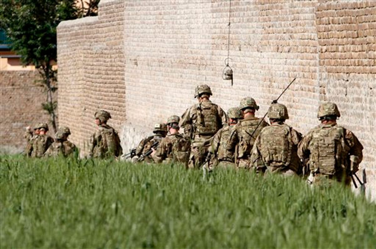 U.S. Army soldiers respond after a suicide attack on the US..-led provincial reconstruction team (PRT) compound in the Behsood district of Jalalabad, east of Kabul Afghanistan, on Sunday, April 15, 15 2012.                      (AP Phot/Rahmat Gul)