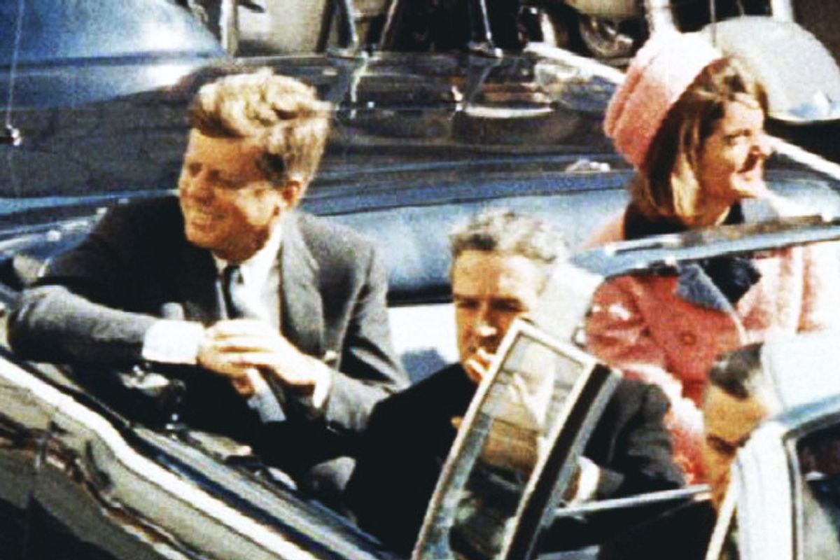 President and Mrs. Kennedy ride through Dallas moments before Kennedy was assassinated on November 22, 1963.    (Reuters)
