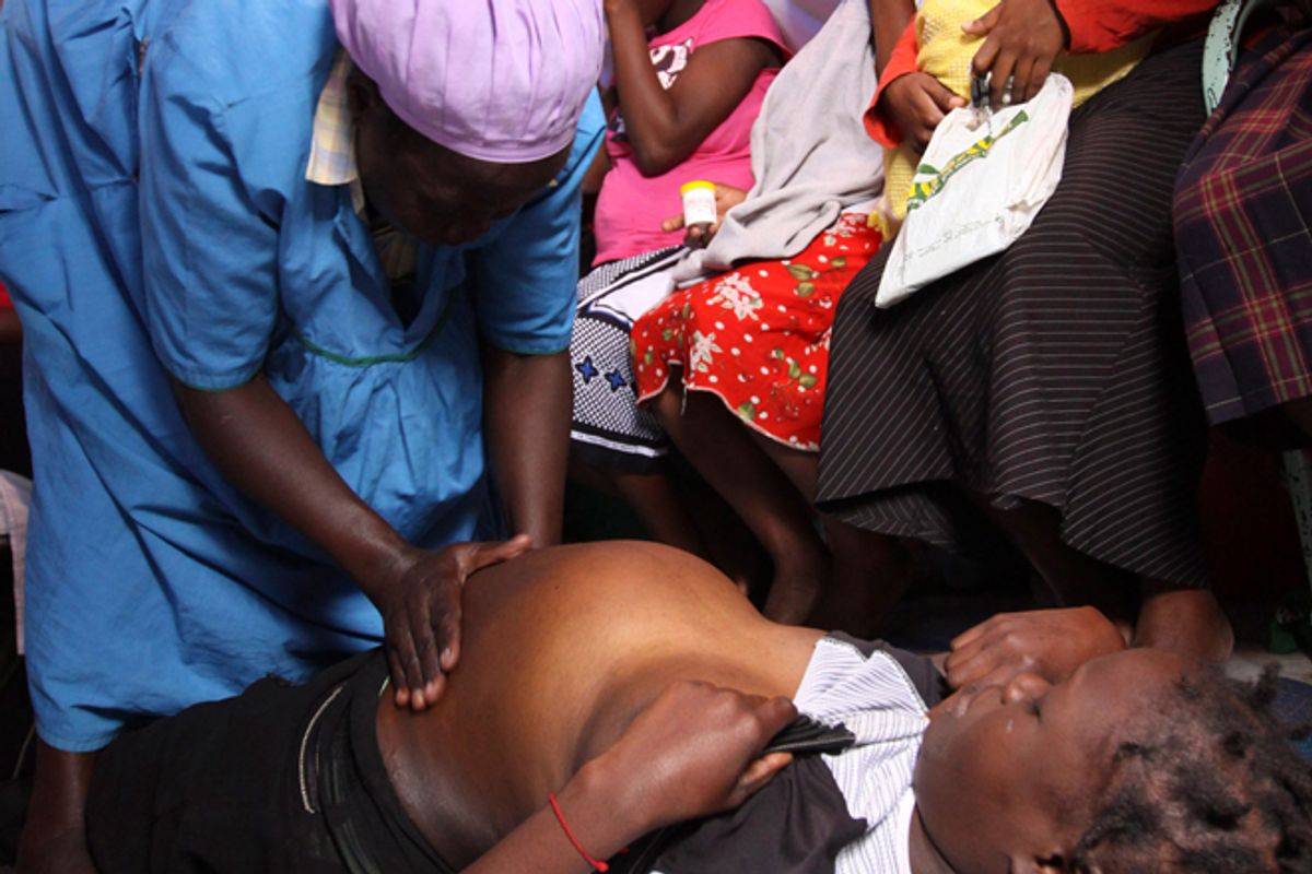 A birth attendant massages one of her clients at a clinic in the Korogocho neighborhood of Nairobi.        (AP/Khalil Senosi)