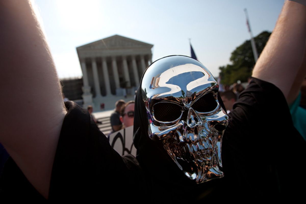 A demonstrator outside the Supreme Court on Thursday.           (AP/Evan Vucci)