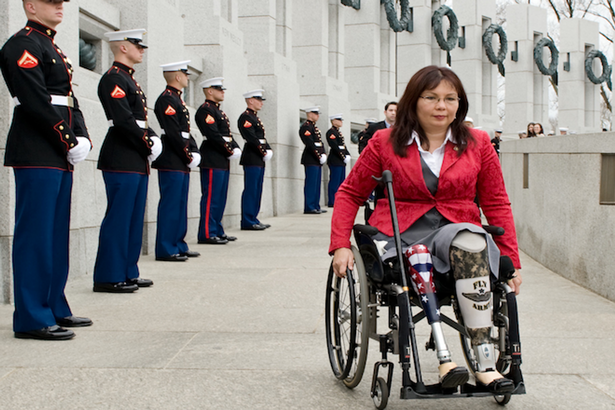 Tammy Duckworth arrives at the World War II Memorial in Washington for a ceremony honoring World War II veterans who fought in the Pacific.    (AP Photo/Cliff Owen)