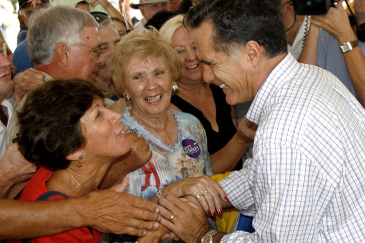 Mitt Romney greets supporters at a campaign rally in The Villages, Fla.       (AP/Joe Kaleita)