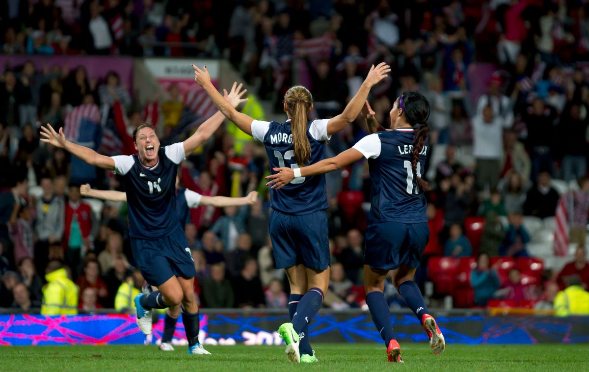 United States' Alex Morgan, center, celebrates with teammates including Abby Wambach, left, and Sydney Leroux after the winning goal was scored past Canada's goalkeeper Erin Mcleod during their semifinal women's soccer match at the 2012 London Summer Olympics, Monday, Aug. 6, 2012, at Old Trafford Stadium in Manchester, England. (AP Photo/)       (AP/Jon Super)