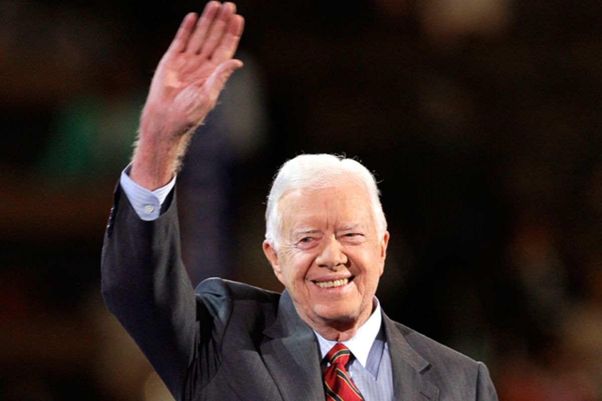 Former President Jimmy Carter waves to the crowd as he goes on stage at the Democratic National Convention in Denver on Aug. 25, 2008.   (AP/Paul Sancya)