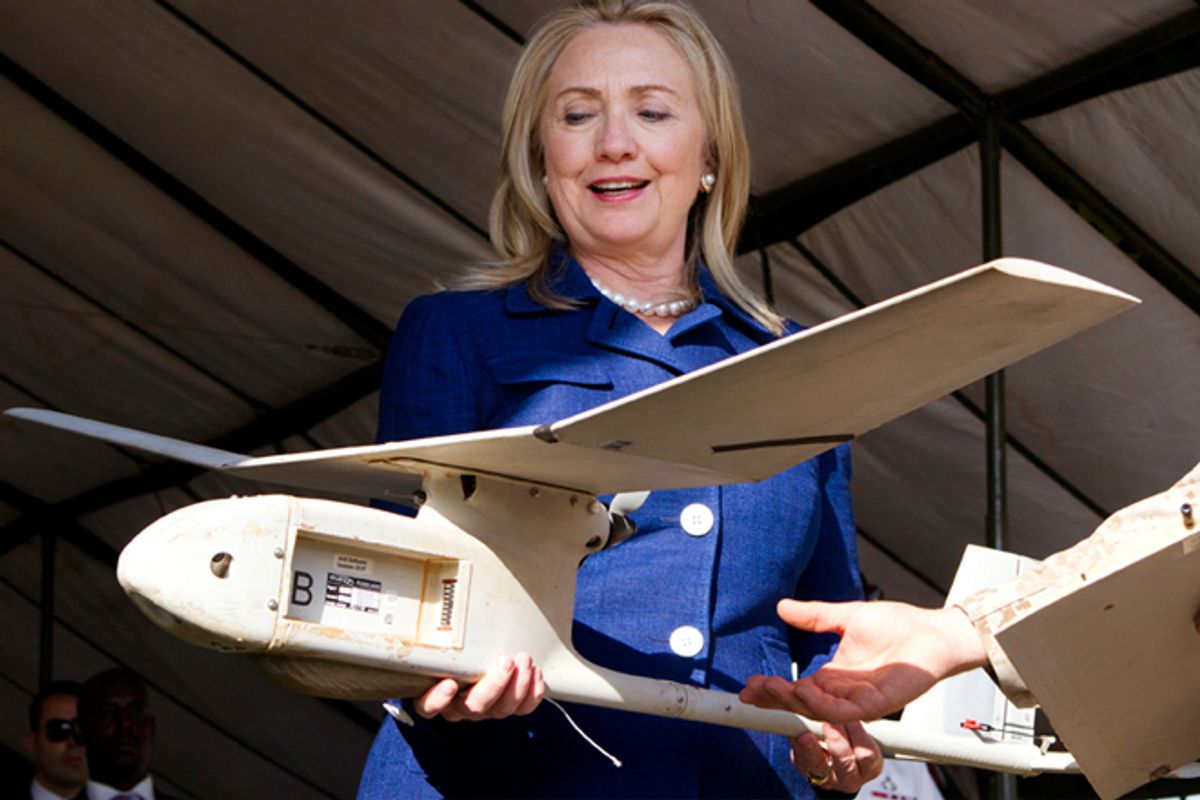 Hillary Clinton holds a small U.S.-made drone that the Ugandan military uses in Somalia to fight al-Qaeda linked militants.           (Reuters)
