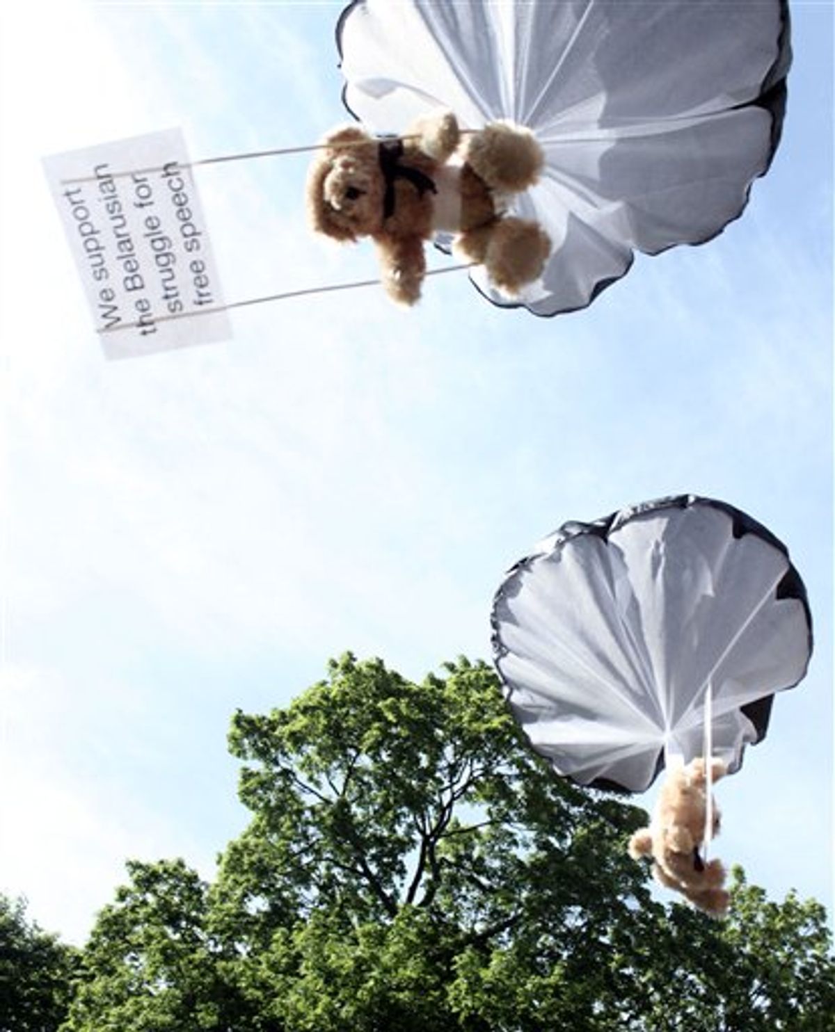 Studio Total teddy bears hang on parachutes during a training in Stockholm, Sweden. (AP/Studio Total/Per Cromwell)     