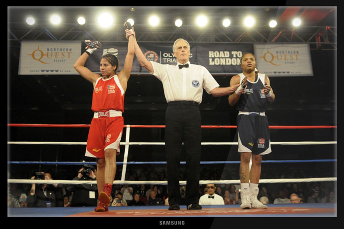 Marlen Esparza, left, and Tyriesha Douglas during a flyweight boxing match at the U.S. Olympic women's boxing team trials on Feb. 18, 2012.     (AP Photo/Jed Conklin)