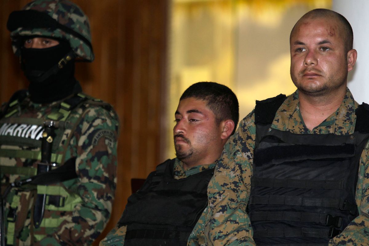 Two men believed to be bodyguards of the alleged leader of the Gulf drug cartel, Jorge Eduardo Costilla Sanchez, aka "El Coss."      (AP/Dario Lopez-Mills)