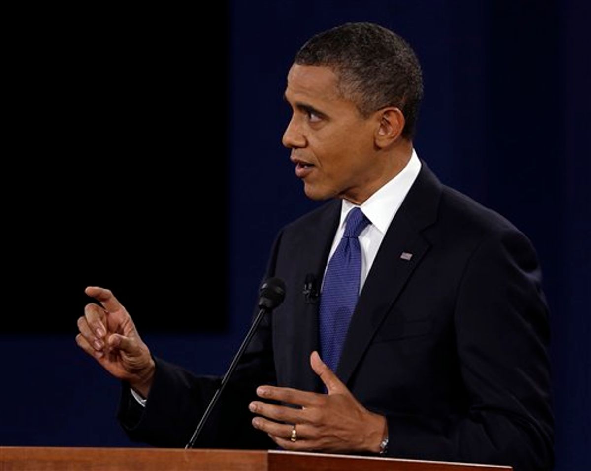President Barack Obama  answers a question during the first presidential debate at the University of Denver.        (AP/Charlie Neibergall)