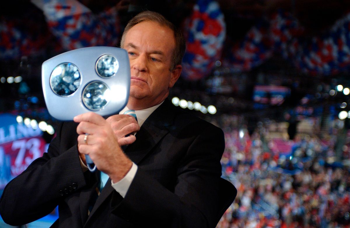 Commentator Bill O'Reilly checks himself out before an interview at the Republican National Convention.      (Reuters/Lisa Miller)
