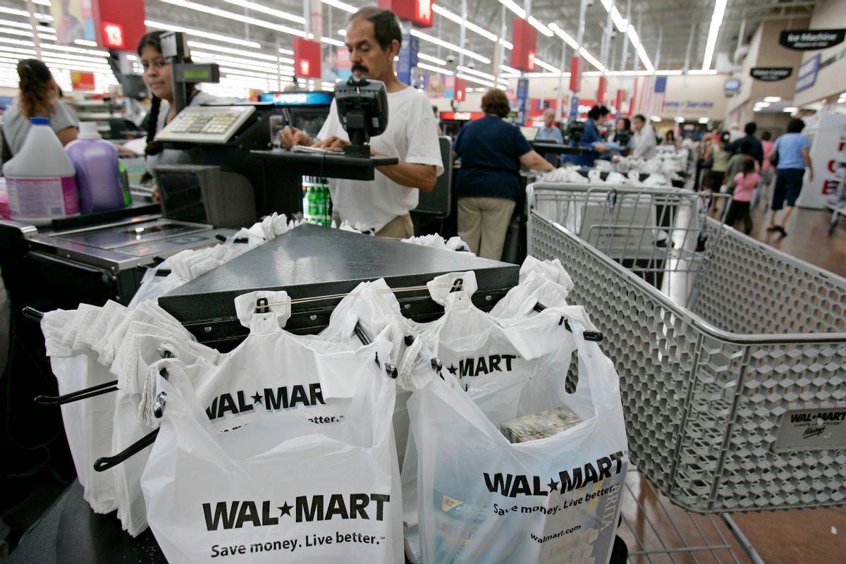 A Walmart customer checks out at Walmart in San Jose, Calif., Wednesday, Aug. 13, 2008.                   (AP Photo/Paul Sakuma)