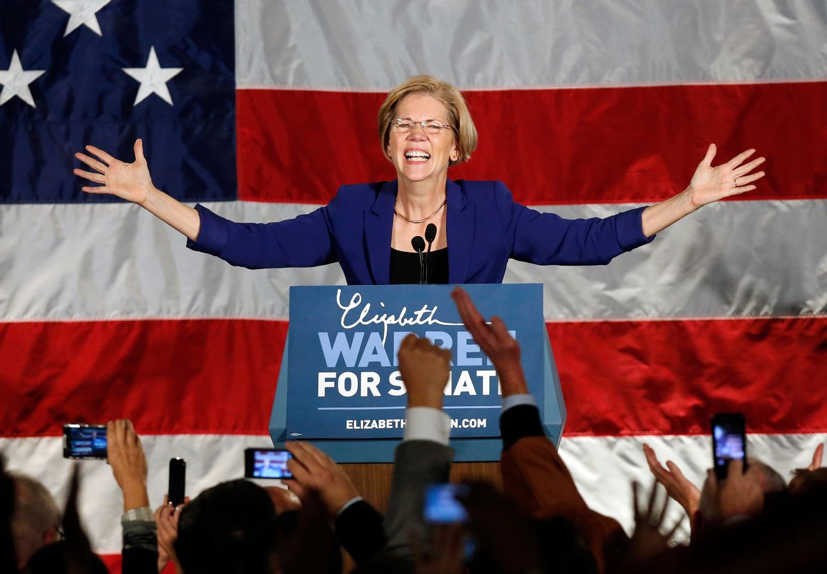 Democrat Elizabeth Warren takes the stage after defeating incumbent GOP Sen. Scott Brown in the Massachusetts Senate race.      (AP/Michael Dwyer)