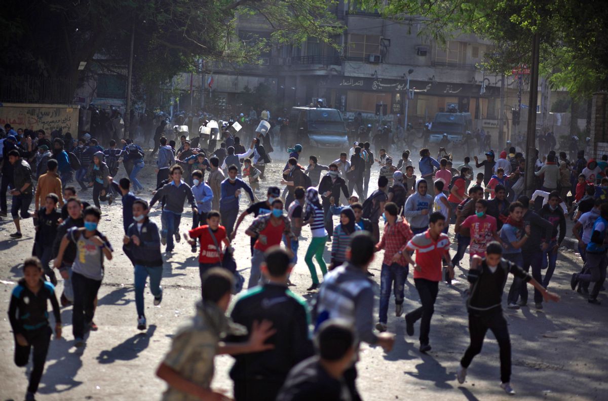 Egyptian protesters clash with security forces near Tahrir square, in Cairo, Egypt.          (AP/Khalil Hamra)