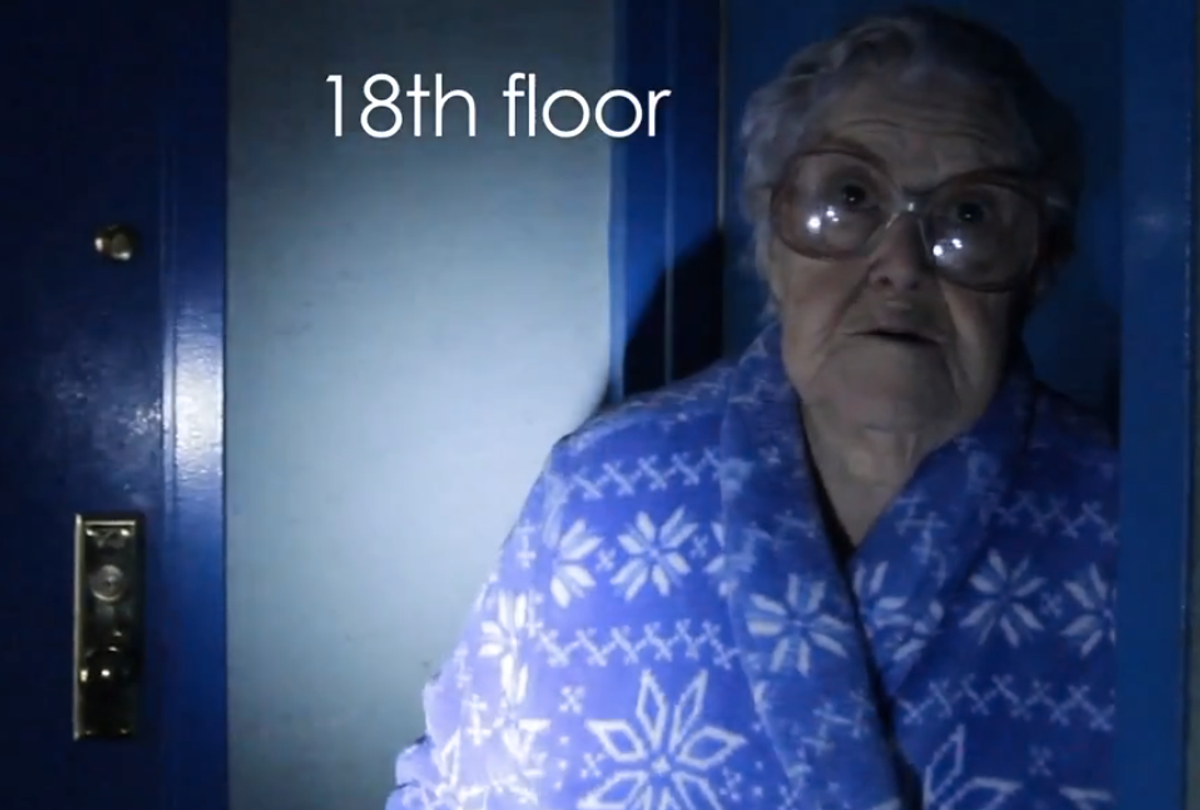 A woman outside her Rockaway apartment, still without power after Sandy (screenshot from YouTube/Kate Baladina)