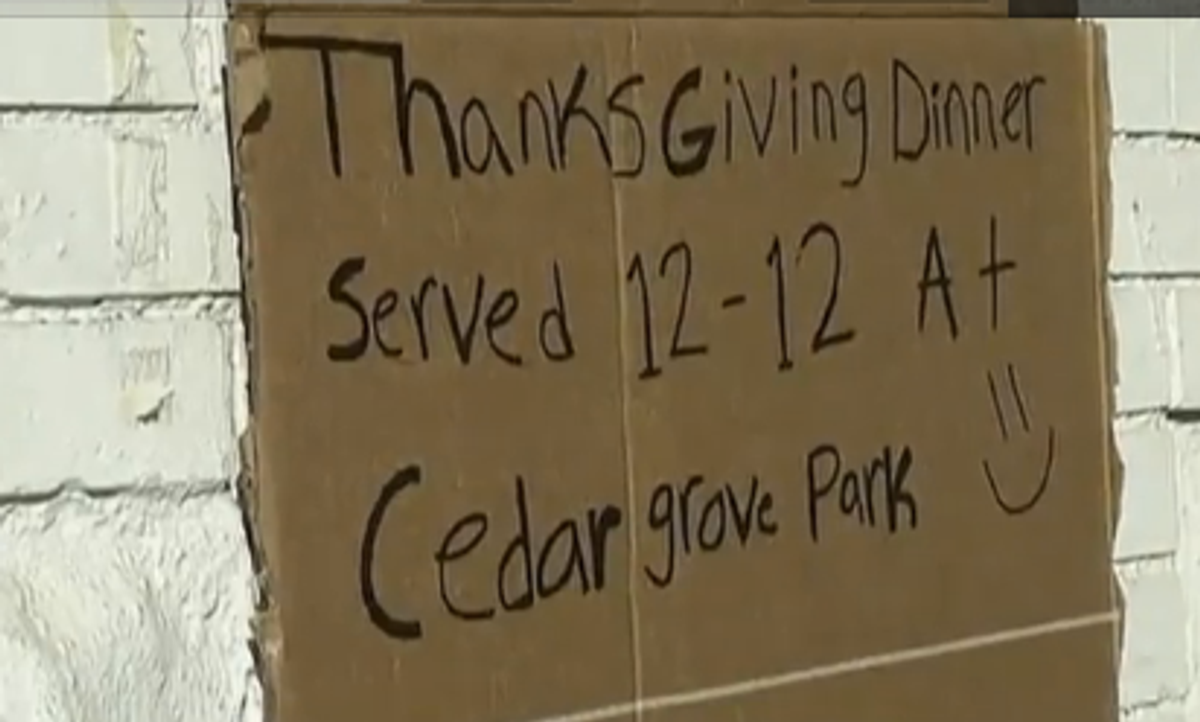  Victims of Sandy on Staten Island share a community meal (screenshot from Reuters video)