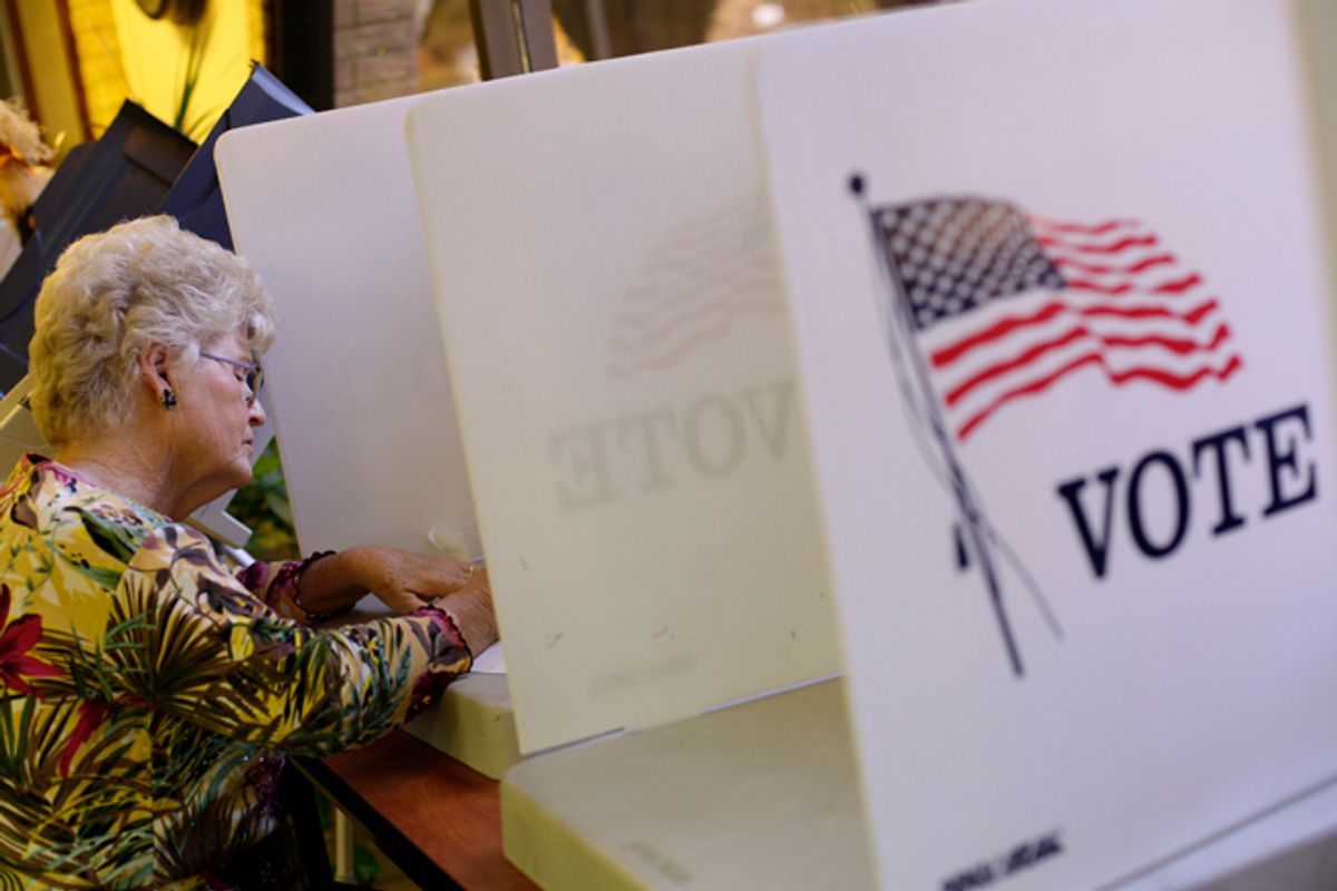 A voter fills out her ballot during early voting at the Gila County Recorders office in Globe, Arizona October 26, 2012.      (Reuters/Joshua Lott)