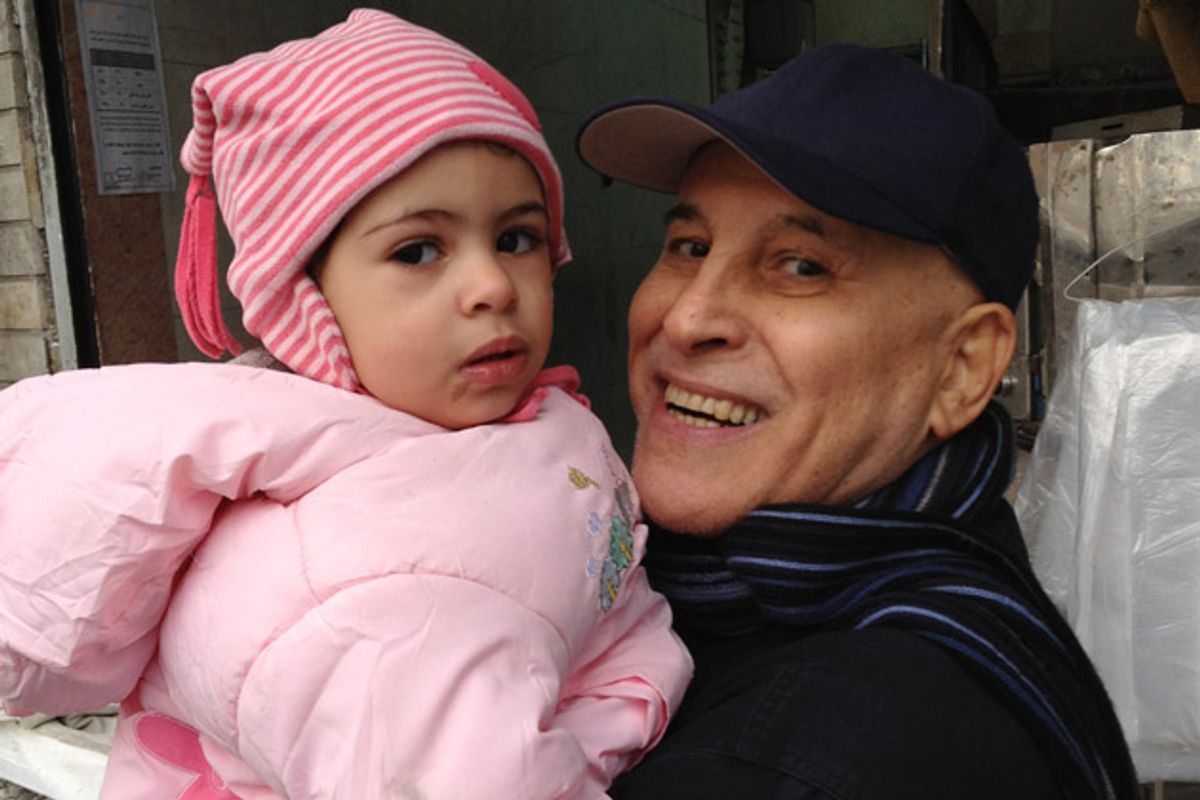 Dr. Rahmatollah Sedigh Sarvestani, pictured with his granddaughter Fatimah, is dying in Iran, but the U.S. has denied his visa request. (Courtesy of the Sarvestani Family)