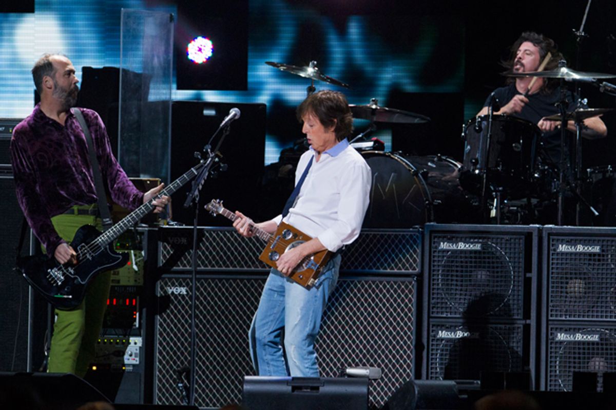 Paul McCartney performs with Kris Novoselic and Dave Grohl during the benefit concert for victims of Superstorm Sandy.         (Reuters/Lucas Jackson)