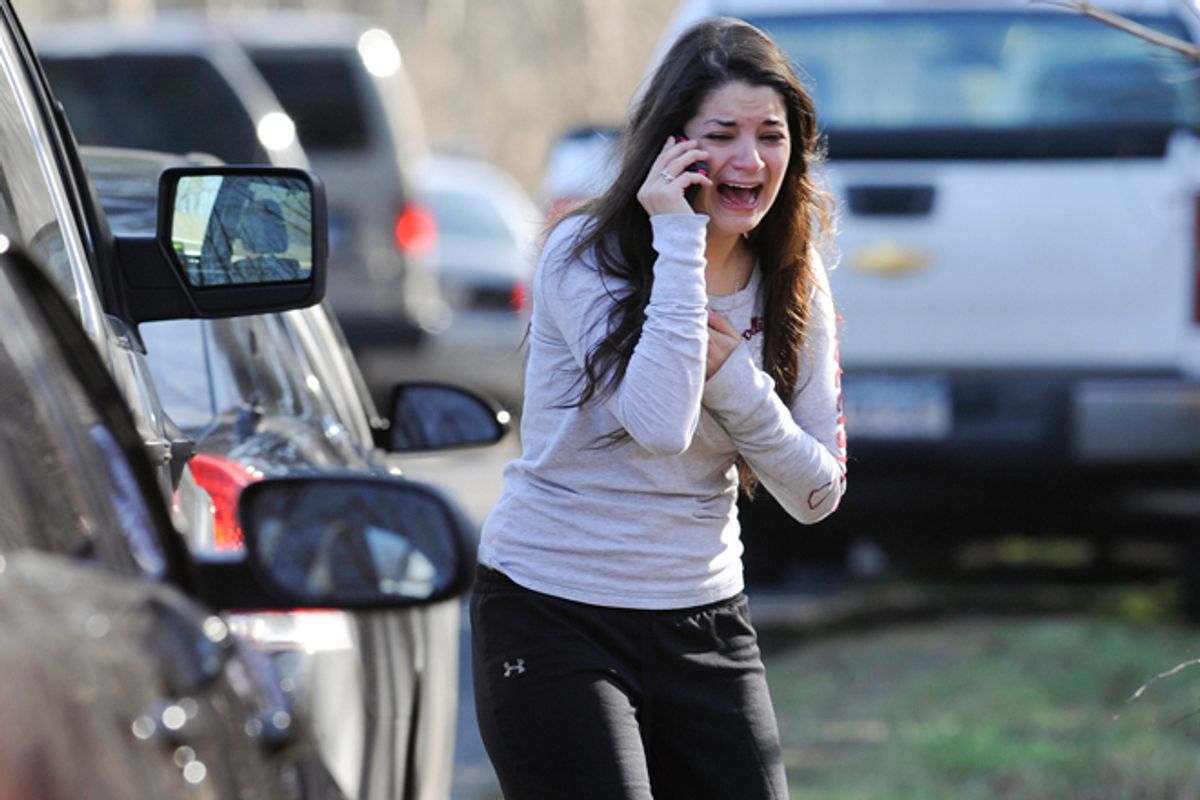 A woman waits to hear about her sister, a teacher, following a shooting at the Sandy Hook Elementary School in Newtown, Conn., Friday, Dec. 14, 2012.                 (AP/Jessica Hill)