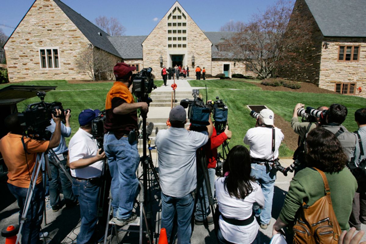Members of the media photograph mourners as they emerge from Blacksburg Presbyterian Church after the memorial service for Virginia Tech shooting victim Kevin P. Granata in Blacksburg, Va., Friday, April 20, 2007. The service was closed to media cameras at the request of the family.      (AP/Charles Dharapak)