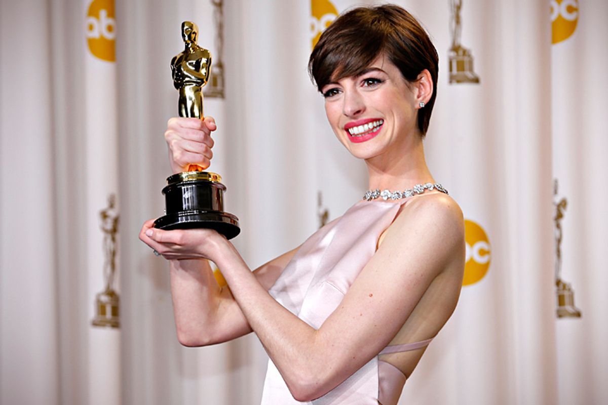 Anne Hathaway holds her Oscar for winning Best Supporting Actress at the 85th Academy Awards.       (Reuters/Mike Blake)
