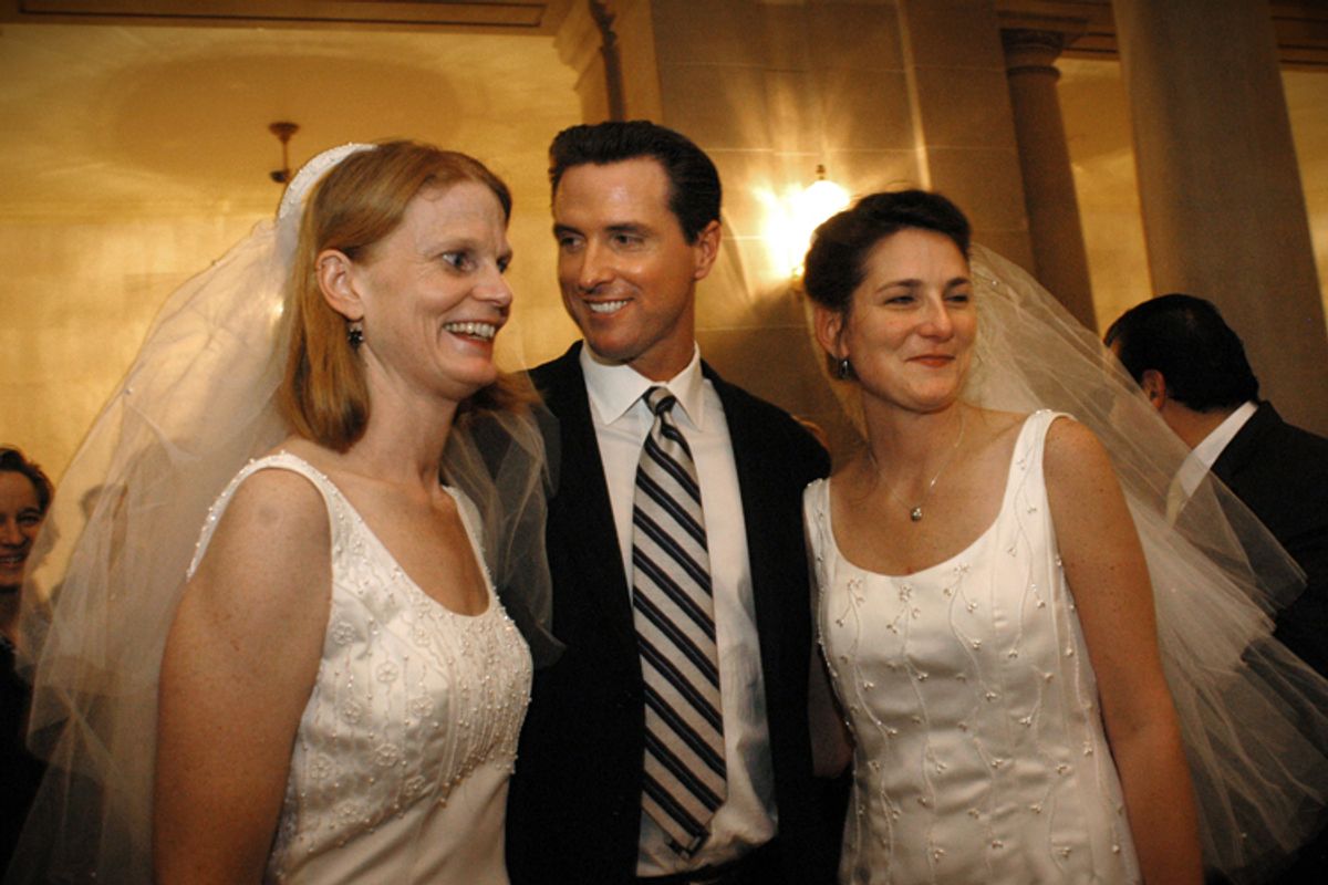  Gavin Newsom with a newly married couple in San Francisco in 2004.       (AP/Erin Lubin)