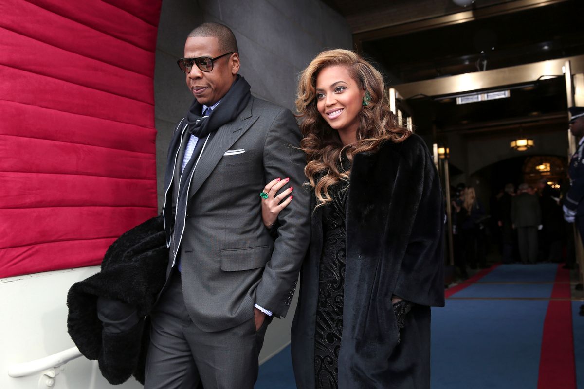 FILE - This Jan. 21, 2013 file photo shows recording artists Jay-Z and Beyonce at the Capitol in Washington for the Presidential Barack Obama's ceremonial swearing-in ceremony during the 57th Presidential Inauguration. Jay-Z and Beyonce sat tightly with Solange. Kelly Rowland embraced Beyonce with a huge hug. And Rihanna spilled some of her drink laughing with Rowland as Music's top stars attended the annual pre-Grammy Roc Nation brunch on Saturday, Feb. 9, at the Soho House in Los Angeles on the eve of the Grammy Awards.  (AP Photo/Win McNamee, Pool, file)           (AP)