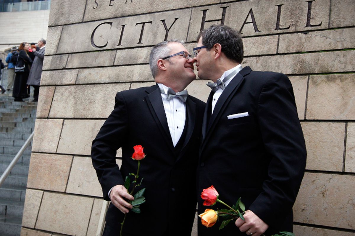 Terry Gilbert, left, kisses his husband Paul Beppler after wedding at Seattle City Hall, Dec. 9, 2012.      (AP/Elaine Thompson)