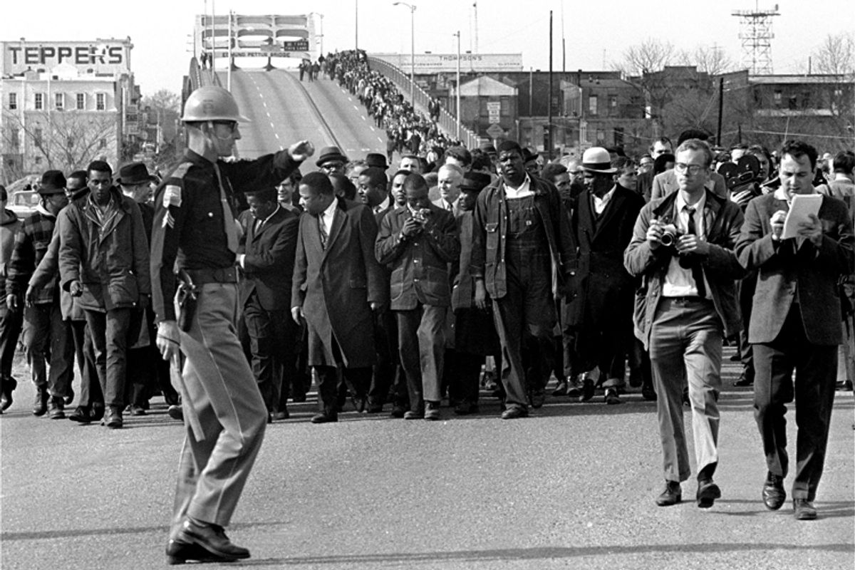 Demonstrators, including Dr. Martin Luther King Jr., stream over an Alabama River bridge at the city limits of Selma, Ala., on March 10, 1965, during a voter rights march.        (AP)