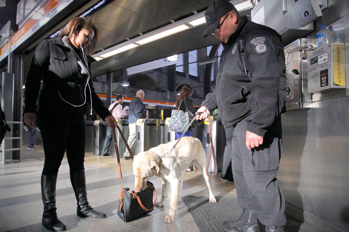 Miller, a Transit Police dog with the Massachusetts Transportation Authority Explosives Detection Unit, sniffs a bag Tuesday at Back Bay Station.     (Reuters/Jessica Rinaldi)