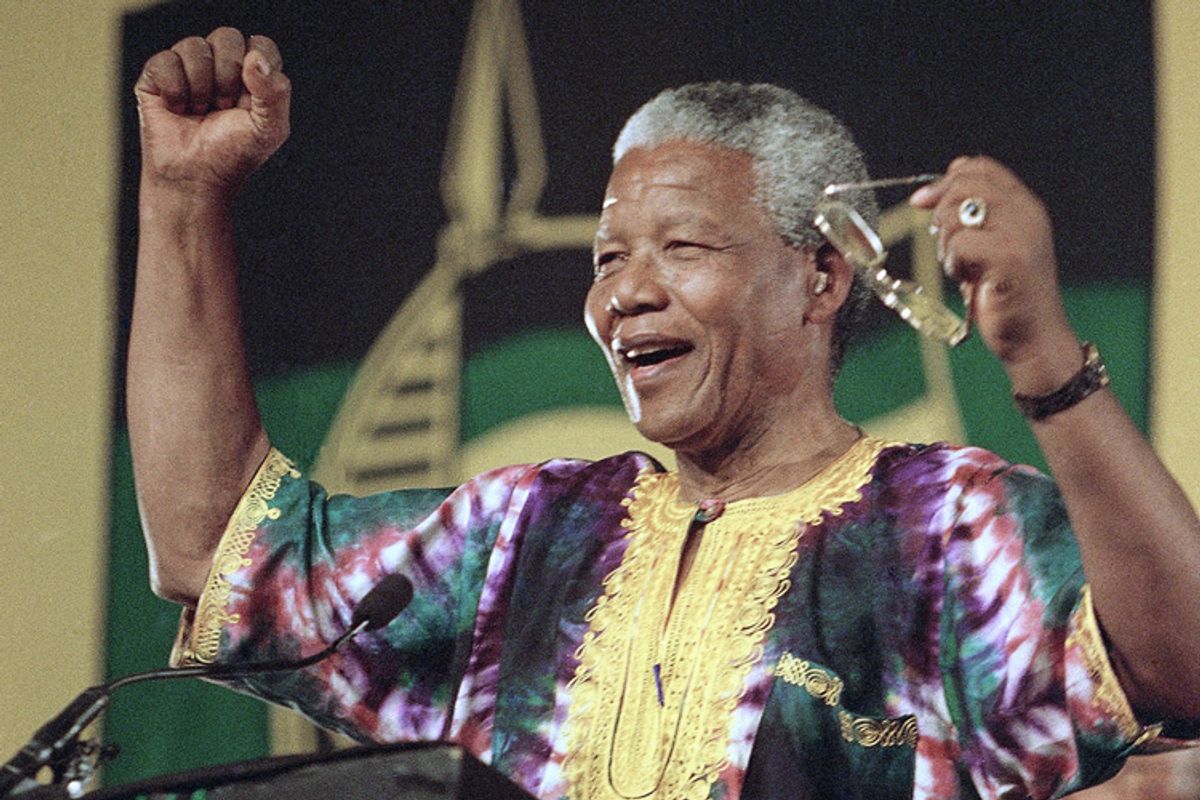 President of the African National Congress Nelson Mandela acknowledges cheers from the crowd as he prepares to unveil the ANC's official election platform in this Jan. 29, 1994 photo in Soweto. (AP/David Brauchli)  