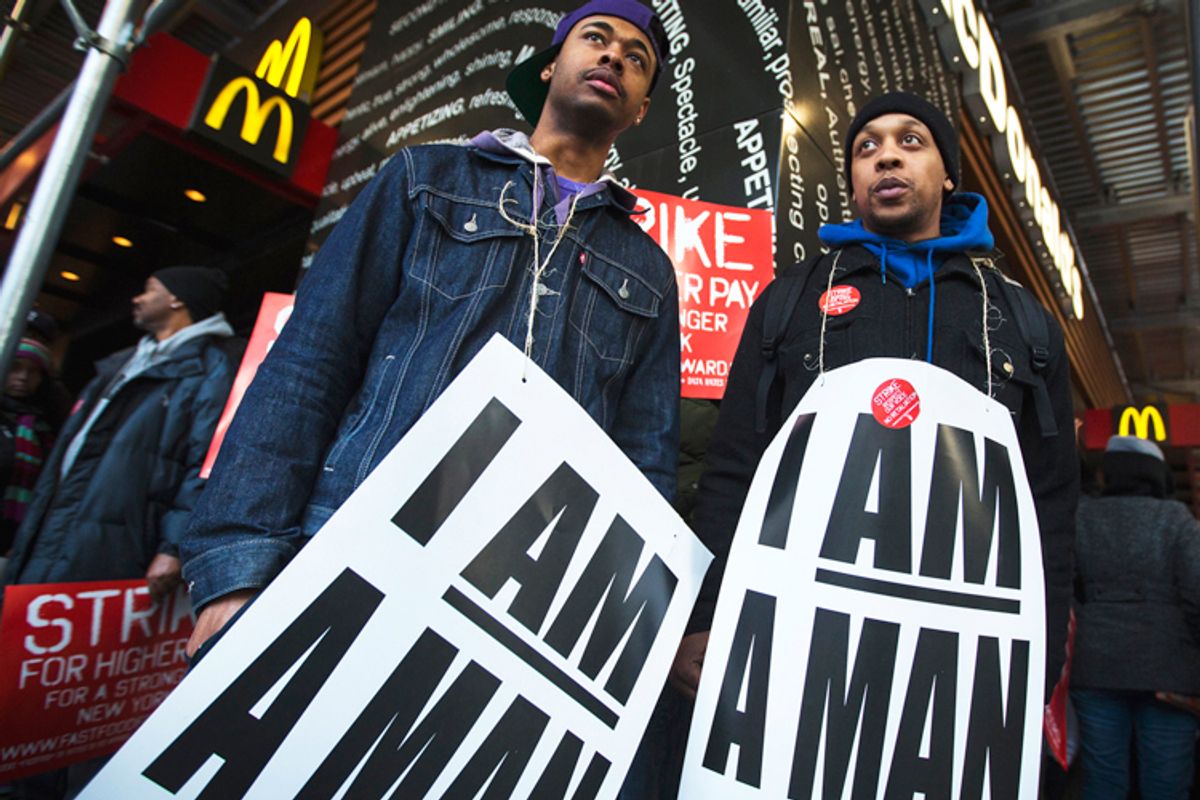 Demonstrators protesting low wages and the lack of union representation in the fast food industry stand outside McDonald's in New York, April 4, 2013.                (Reuters/Lucas Jackson)