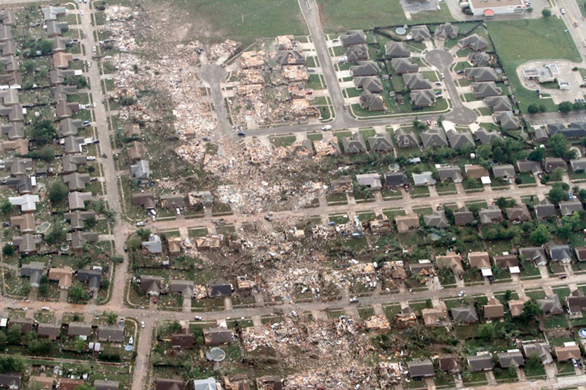 The remains of homes hit by a massive tornado in Moore, Okla., Monday May 20, 2013.     (AP/Steve Gooch)
