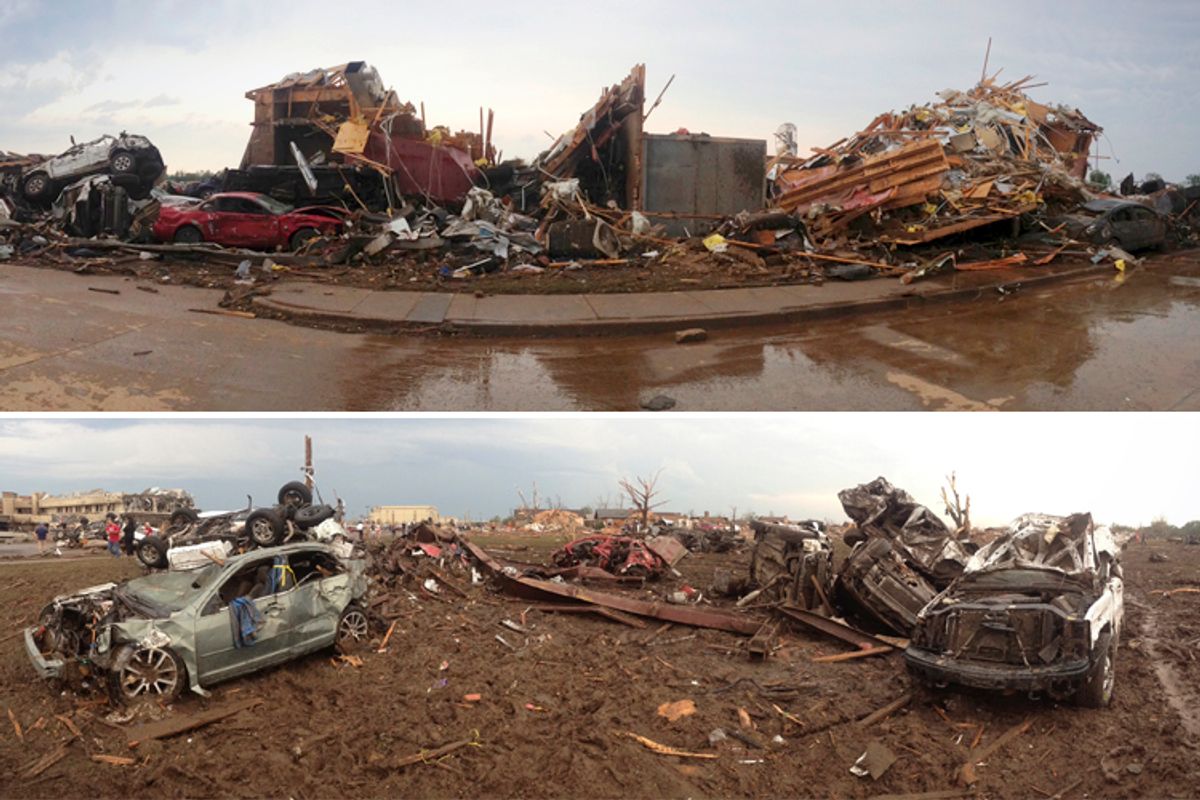 Destroyed buildings and overturned cars are seen after a huge tornado struck Moore, Oklahoma, near Oklahoma City, May 20, 2013.         (Reuters/Richard Rowe)