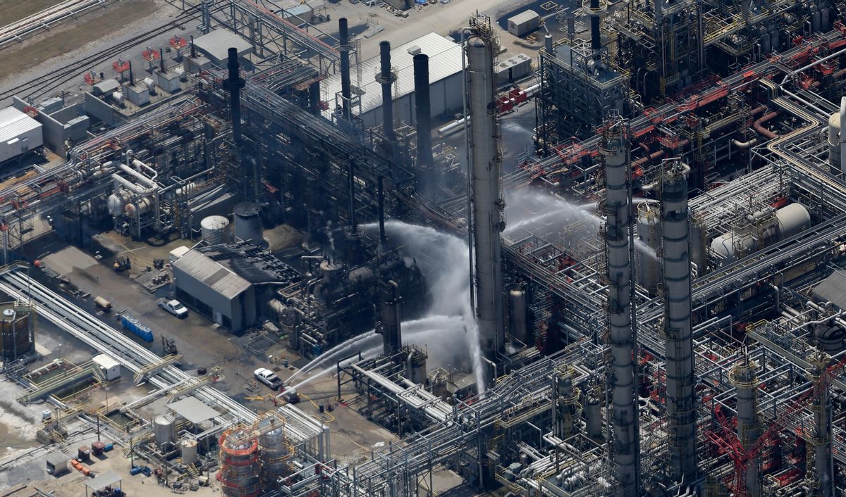 A chemical plant fire is seen in this aerial photo about twenty miles southeast of Baton Rouge, in Geismer, La., Thursday, June 13, 2013.   (AP/Gerald Herbert)