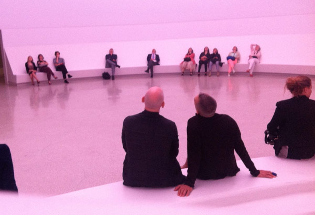 Purple-tinted viewers take in “Aten Reign” in the Guggenheim’s lobby  (Jillian Steinhauer)