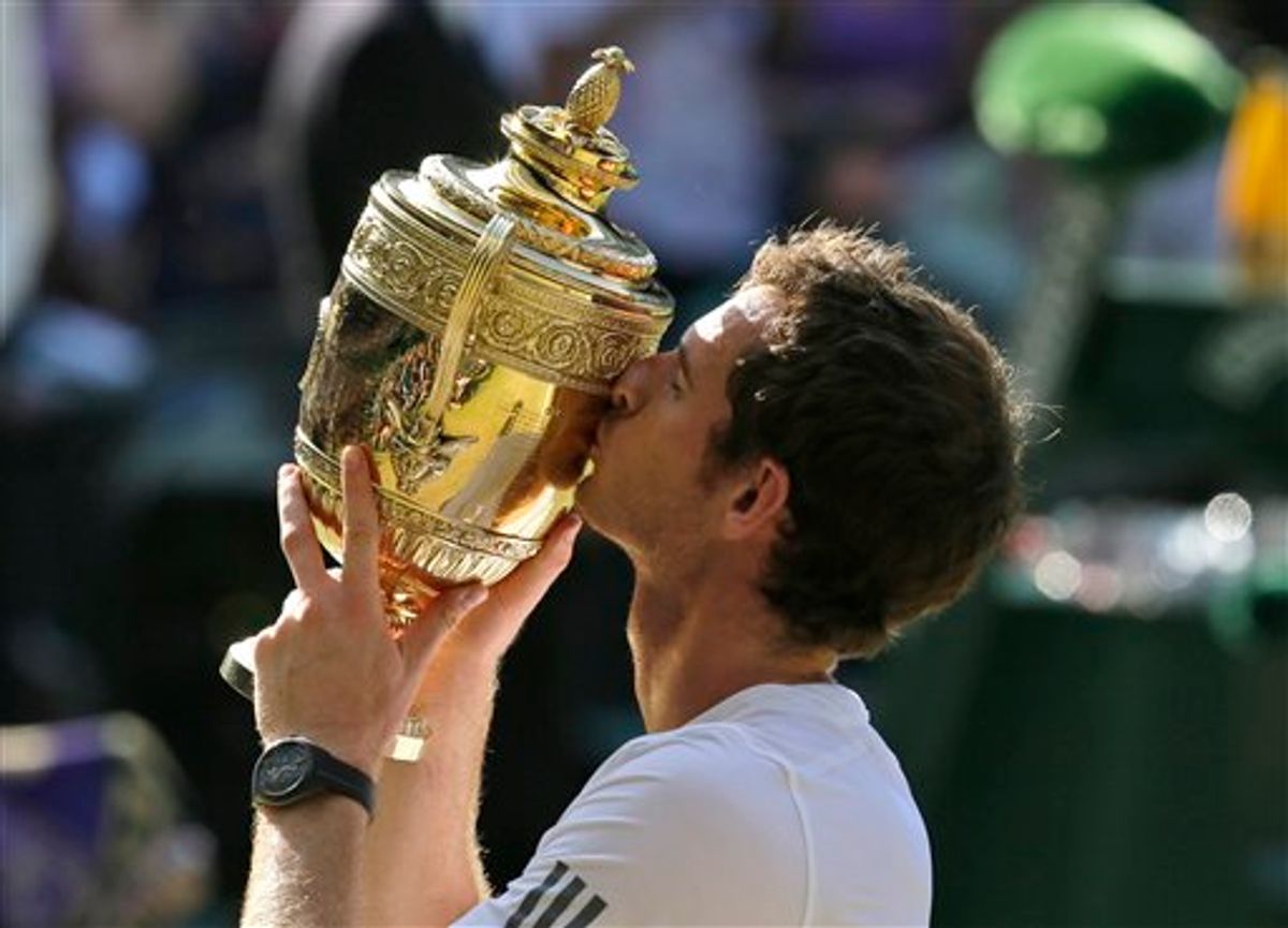 Andy Murray of Britain poses with the trophy after defeating Novak Djokovic of Serbia during the Men's singles final match at the All England Lawn Tennis Championships in Wimbledon, London, Sunday, July 7, 2013. (AP Photo/Alastair Grant)
