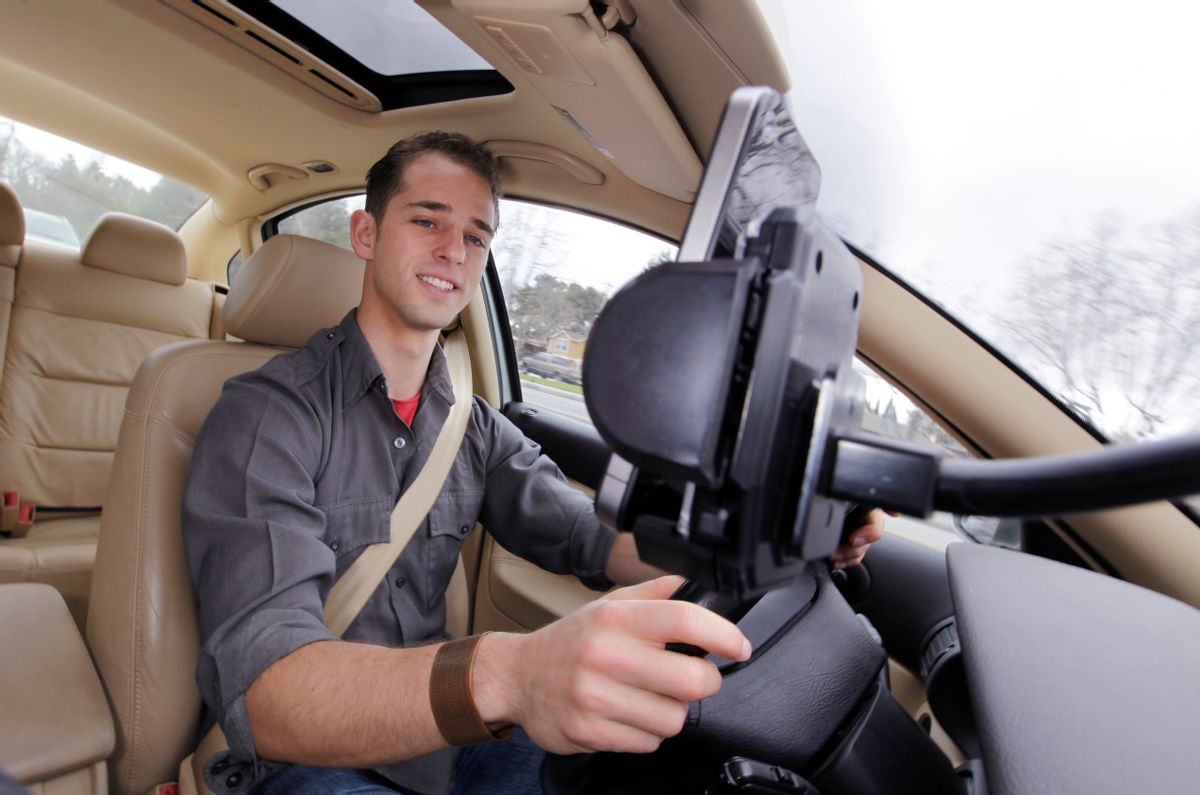 Ben Gleitzman uses a traffic and navigation app called Waze as he drives to work in Menlo Park, Calif.   (AP/Paul Sakuma)