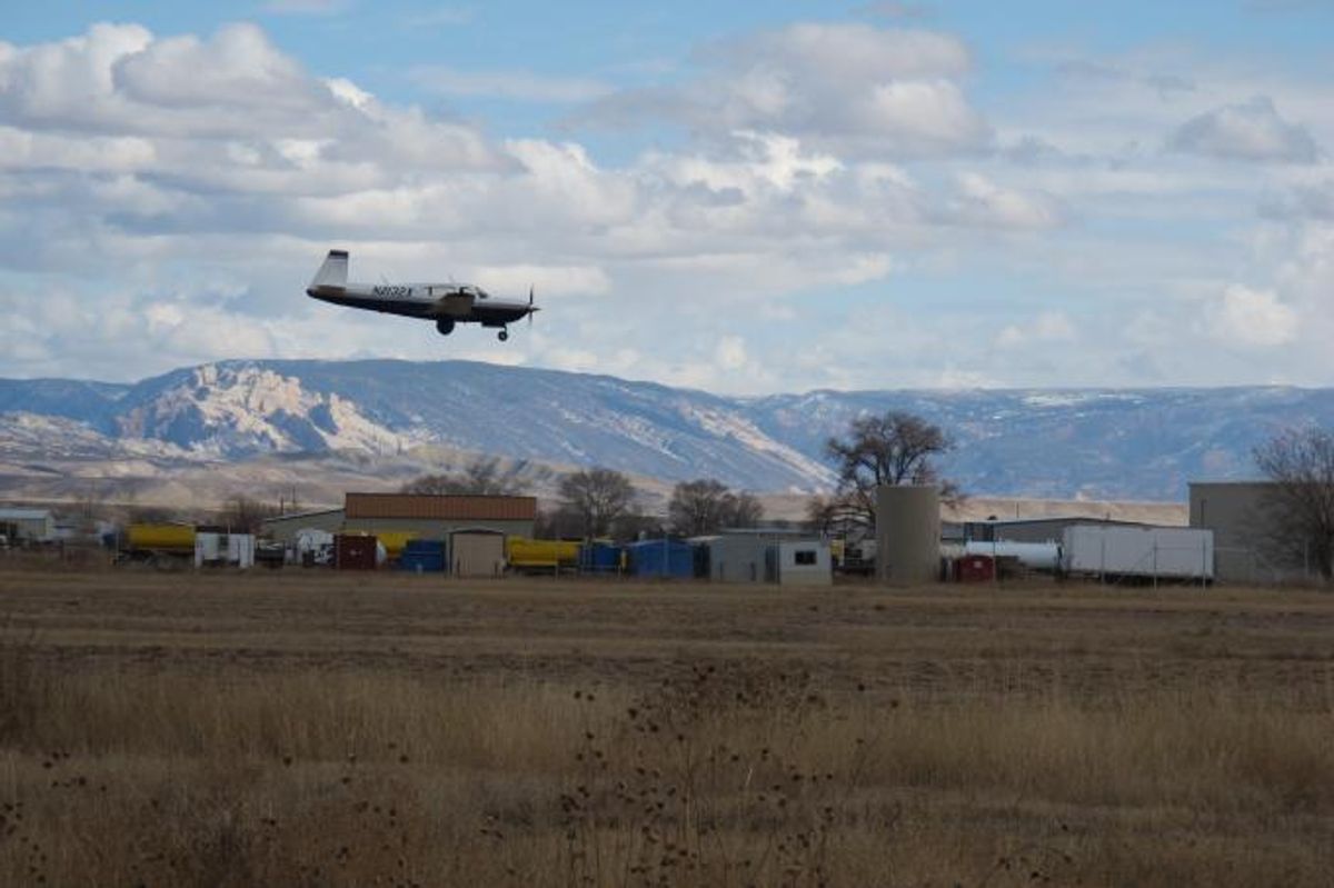 A research aircraft comes in for a landing in Vernal, Utah. Sensitive instruments aboard let CIRES and NOAA researchers measure atmospheric levels of methane­ and other chemicals during flights through Utah's Uintah. (Sonja Wolter/CIRES and NOAA)