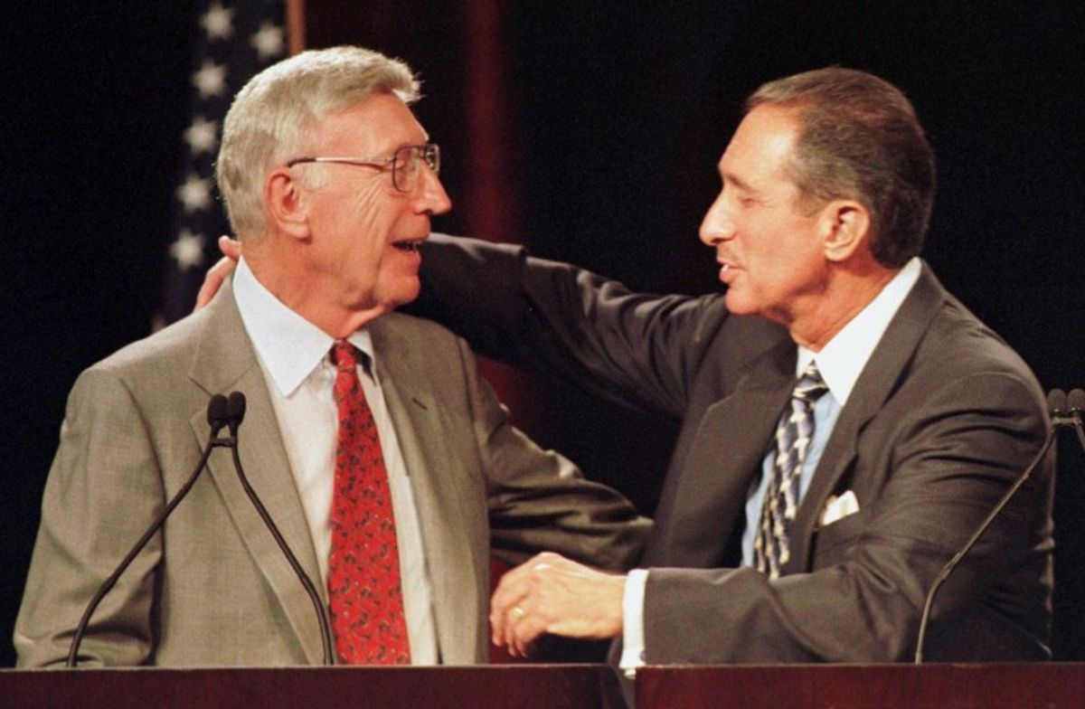 Home Depot Chairman Bernard Marcus, left, and Chief Executive Officer Arthur Blank hug each other on Wednesday, May 26, 1999. (Associated Press)