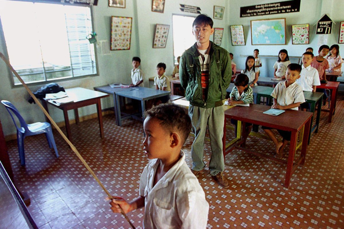 Cambodian orphans study English in a classroom at an orphanage on the outskirts of Phnom Penh Cambodia.    (AP/Andy Eames)