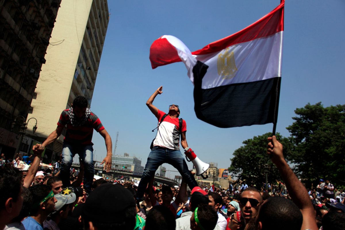Supporters of Egypt's ousted President Mohammed Morsi chant slogans during a protest in Cairo, Aug. 16, 2013.     (AP/Khalil Hamra)