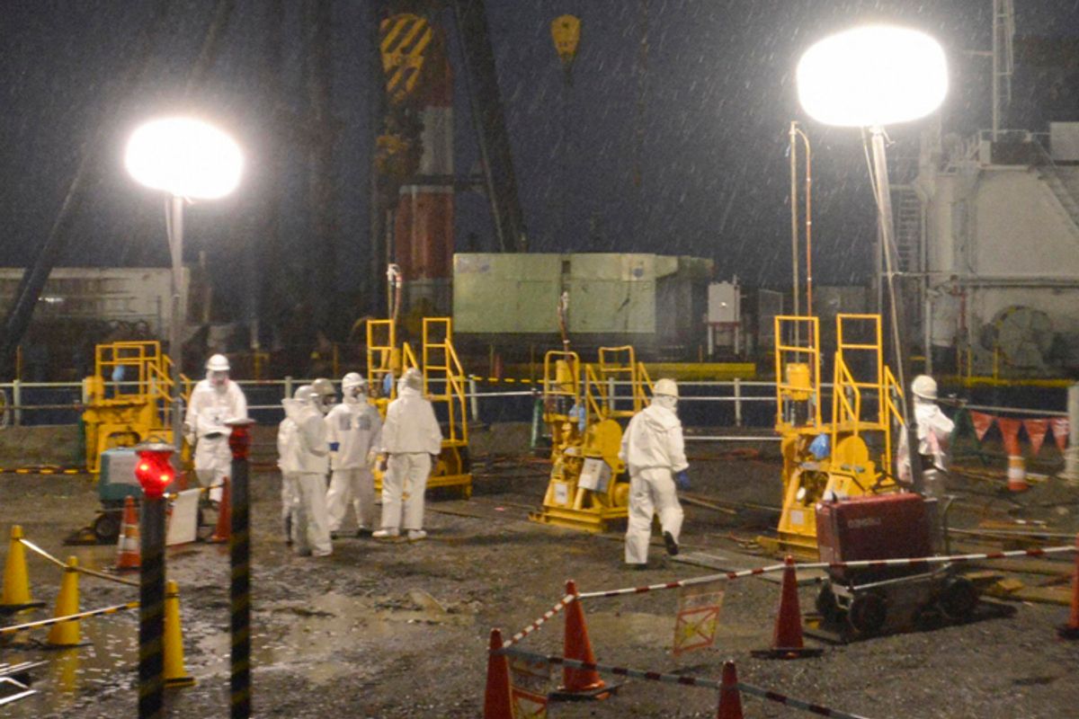 Workers at the tsunami-crippled Fukushima Daiichi nuclear power plant in Fukushima.     (Reuters/Kyodo Kyodo)